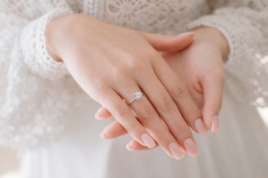 Bride with engagement ring on her finger. Closeup